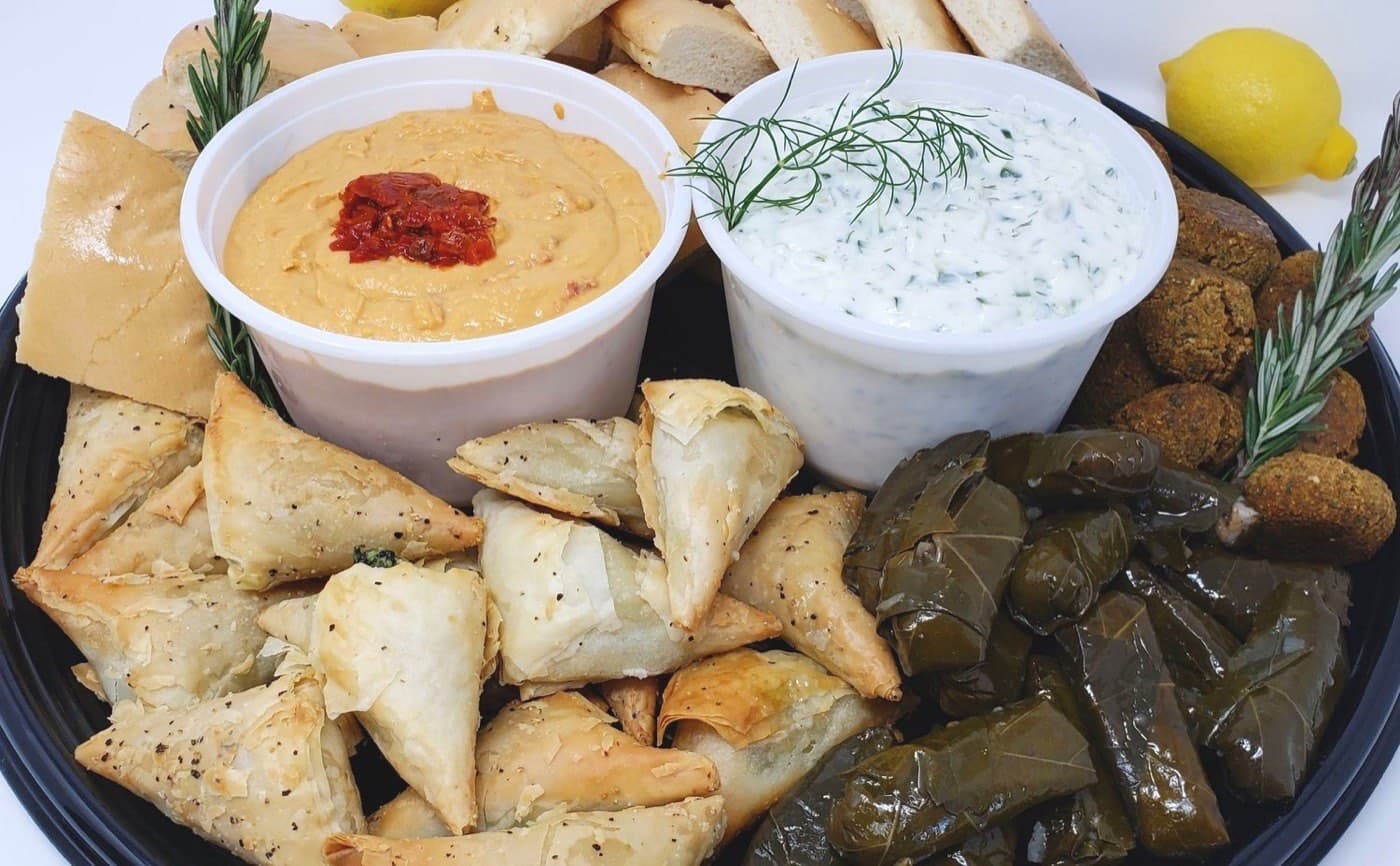 A Mediterranean platter of hummus, falafel, and pita